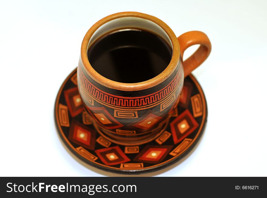 A hand made and decorated coffee cup. A hand made and decorated coffee cup