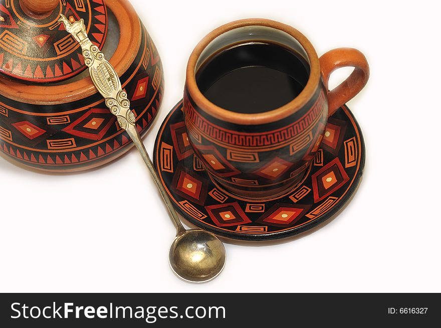 A hand made and decorated coffee cup, with some more elements. A hand made and decorated coffee cup, with some more elements.