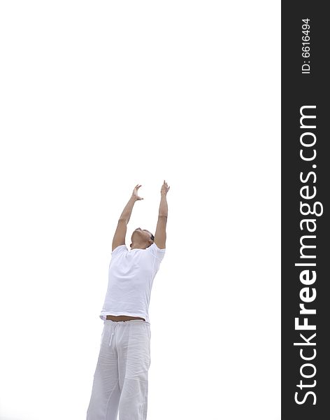 A young man practicing yoga outdoors. A young man practicing yoga outdoors