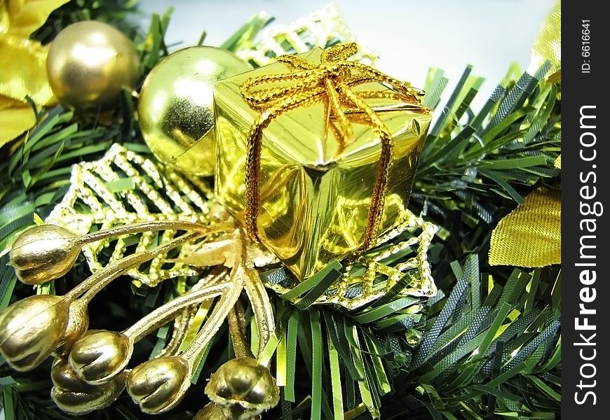 Beautiful christmas ornament with a golden gift. Beautiful christmas ornament with a golden gift.