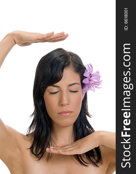 Female with flower showing hand gesture against a white background