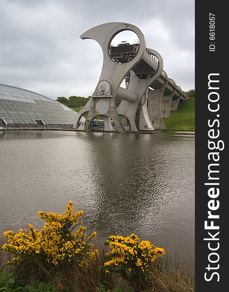 Falkirk Wheel, Scotland, with a yellow flowers