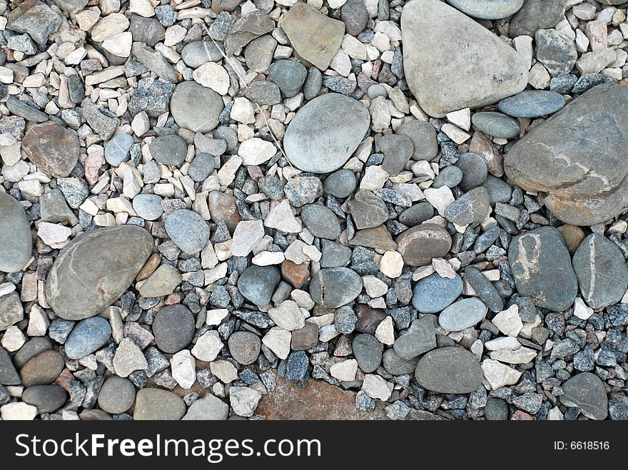 Picture of the heap of difference grey river stones. Picture of the heap of difference grey river stones