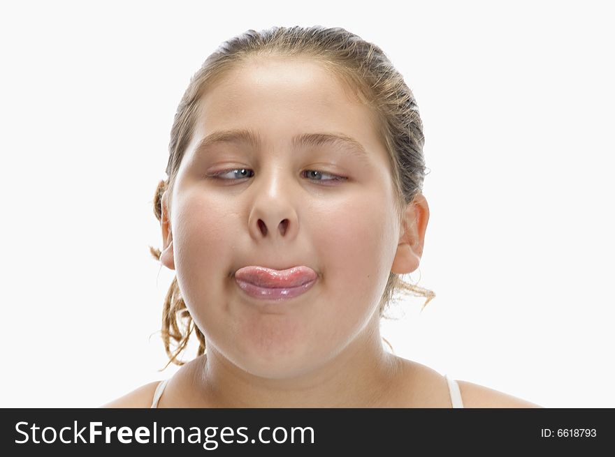 Girl keep her tongue out on an isolated white background