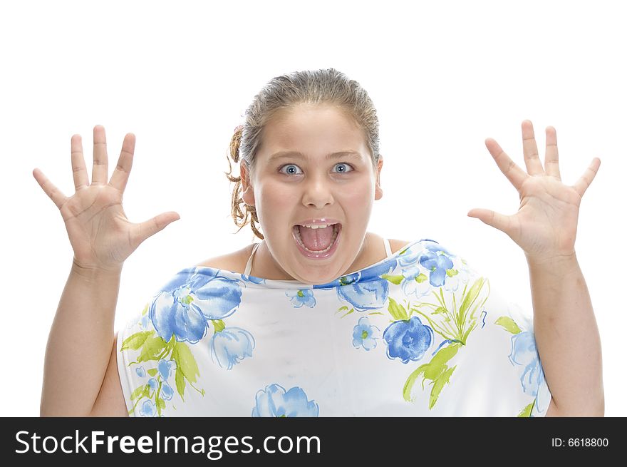 Surprised young girl against white background