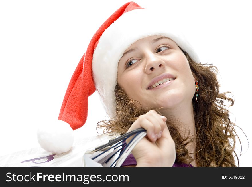 Female with carry bags and santa cap on an isolated background