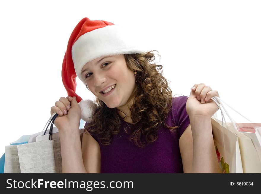 Teenage girl holding bags against white background