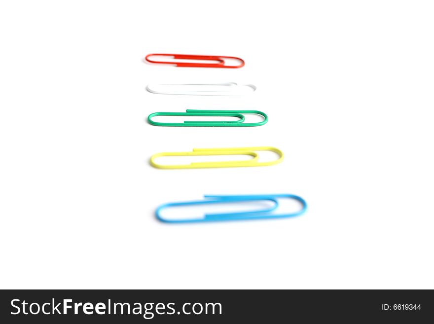 5 isolated paper clips in a studio