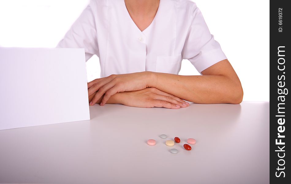 Doctor table with pills and card with copyspace