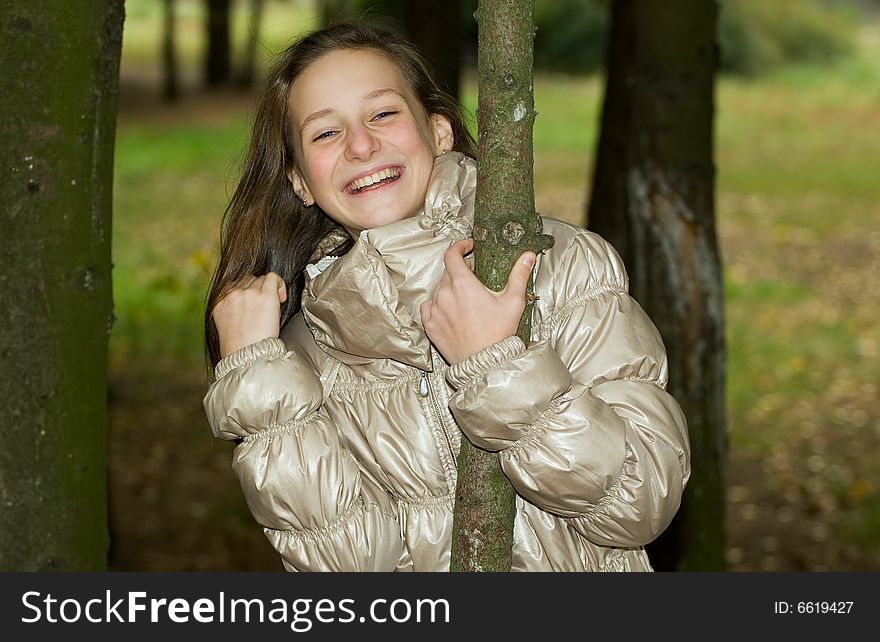 Girl laughter on walk in autumn park