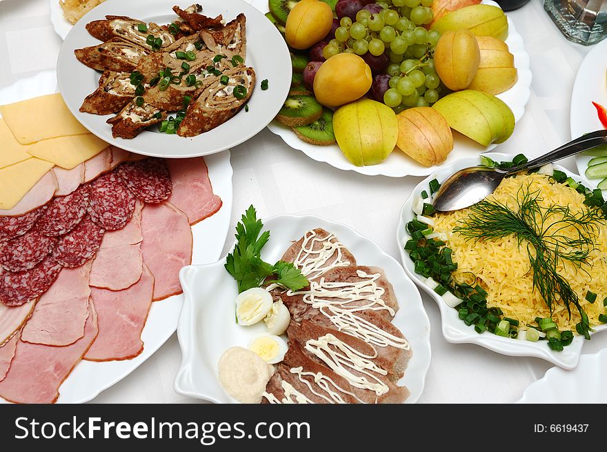 Table served with different dishes. Table served with different dishes