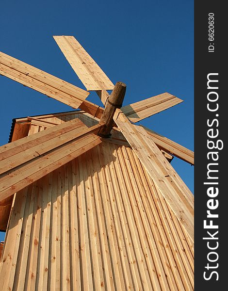 Wooden windmill against clear deep blue sky 2