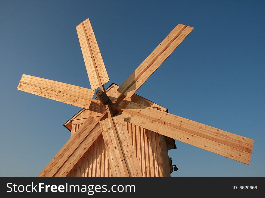 Wooden Windmill Against Clear Deep Blue Sky 4