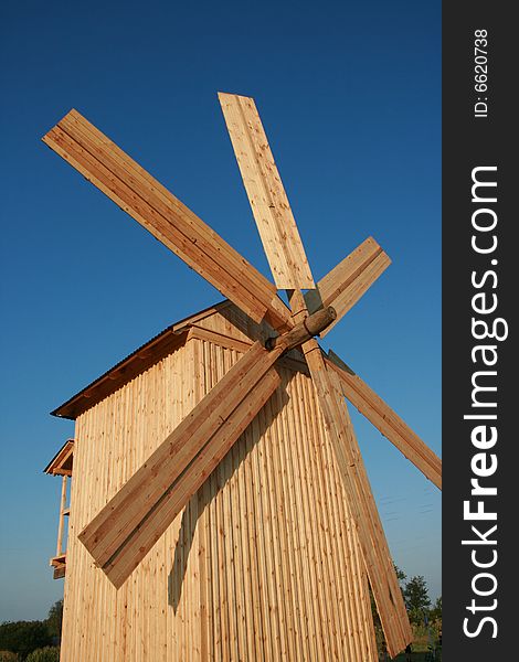 Wooden Windmill Against Clear Deep Blue Sky 6