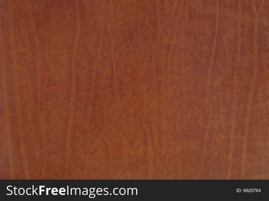 Fragment of new brown leather detailed background. Fragment of new brown leather detailed background