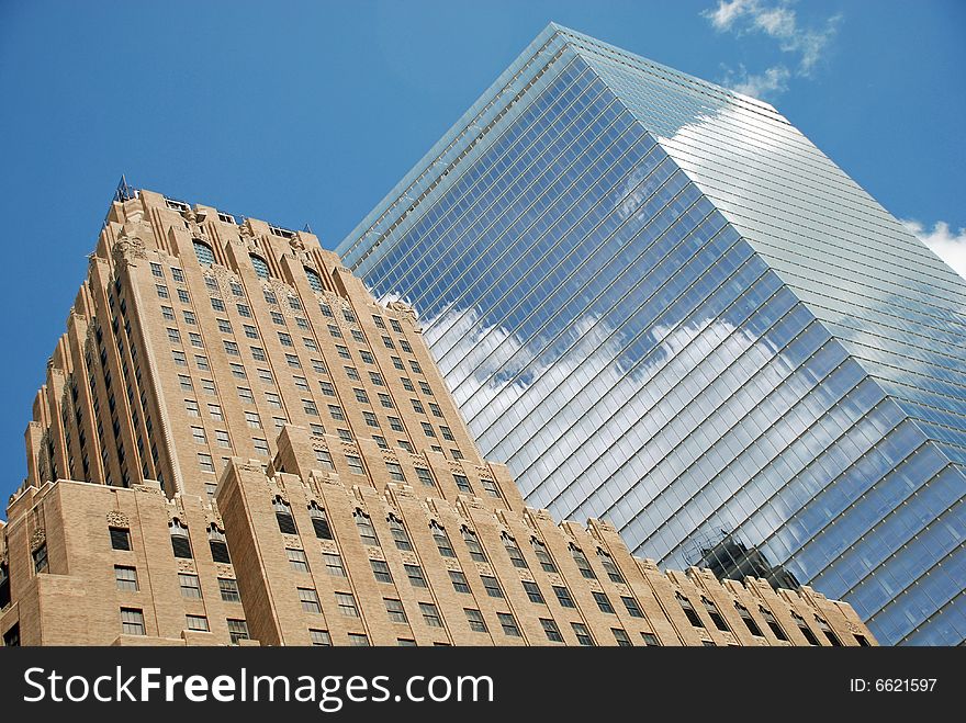 Image captures two office buildings in New York City. Image captures two office buildings in New York City.