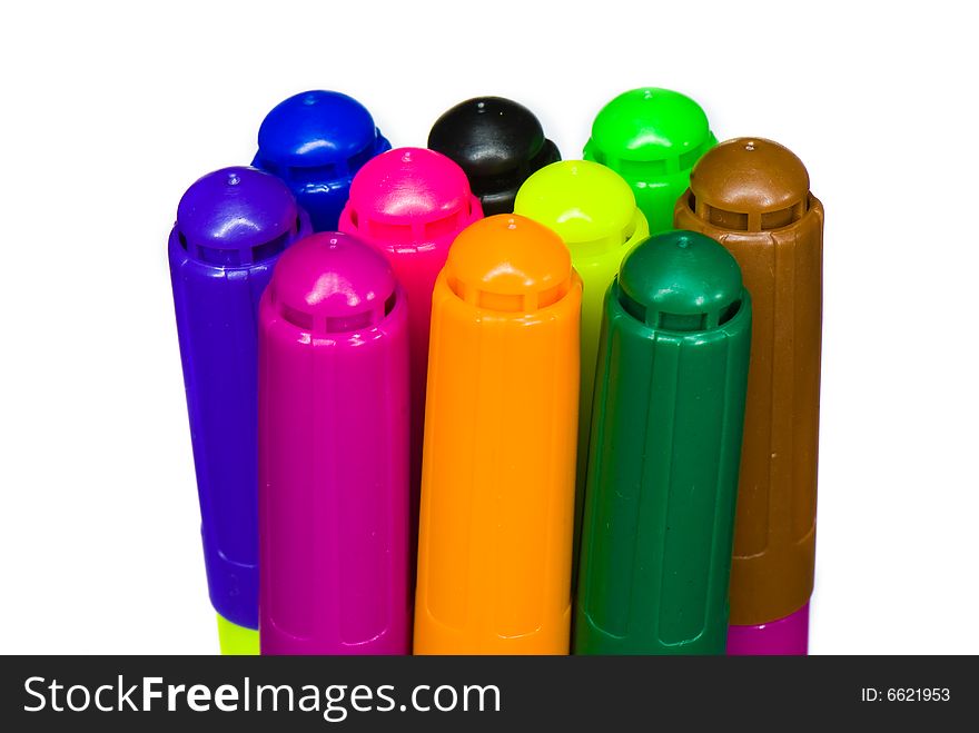 Varicoloured markers on the white isolated background