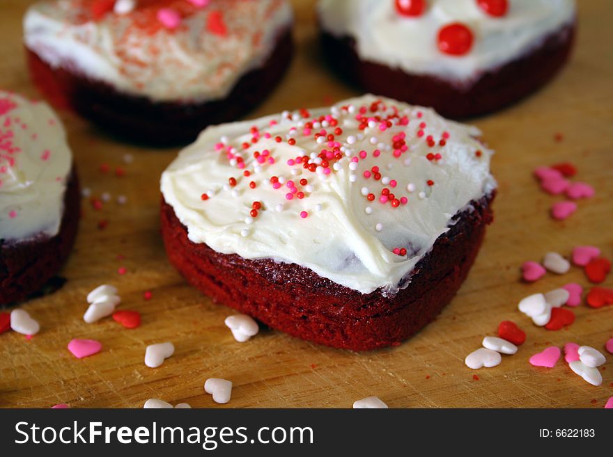 Close up of heart shaped cakes with sprinkles. Close up of heart shaped cakes with sprinkles