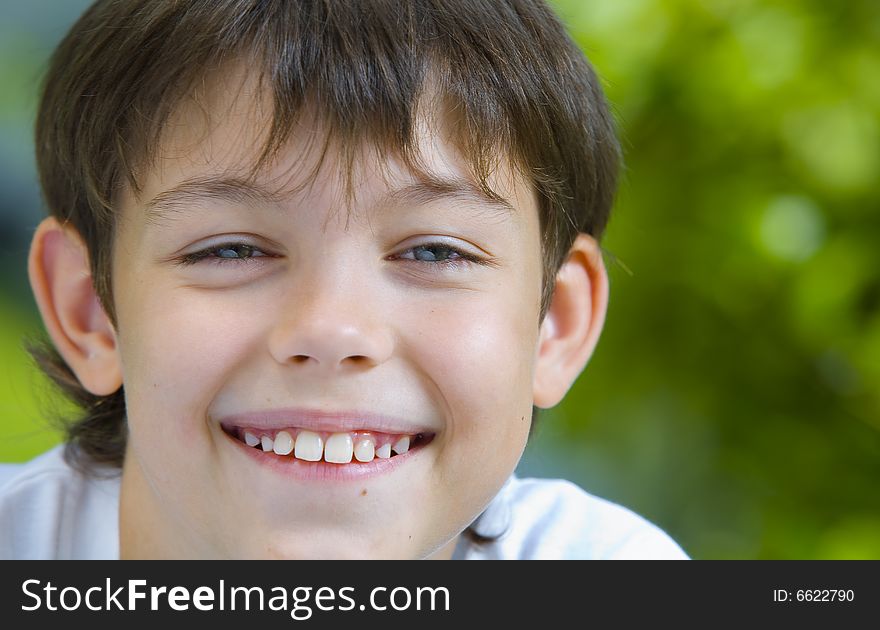 Portrait of happy smiling  kid in summer environment. Portrait of happy smiling  kid in summer environment