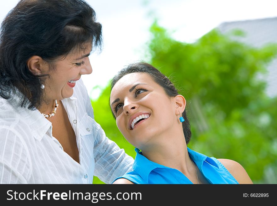 Portrait of  two beautiful women in summer environment. Portrait of  two beautiful women in summer environment