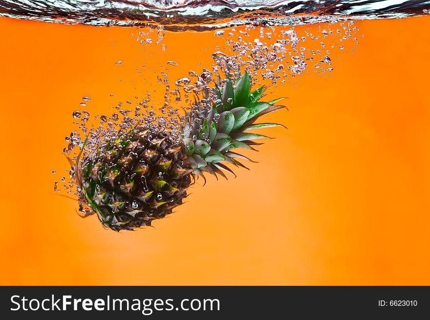 View of nice big pineapple getting through the water. View of nice big pineapple getting through the water