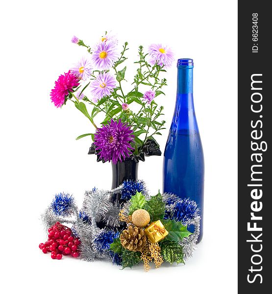 Black vase with colors and New Year's ornaments with dark-blue bottle fault on white background