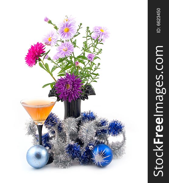 Black vase with colors and New Year's ornaments with blue spheres on white background