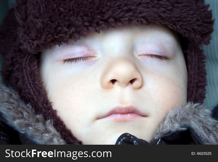 Sleeping baby boy dressed warm during winter. Sleeping baby boy dressed warm during winter