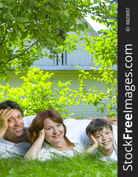 Portrait of young happy family in summer environment. Portrait of young happy family in summer environment