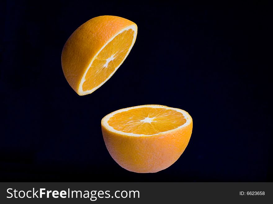 Fresh orange natural divided into two parts. Fresh orange natural divided into two parts