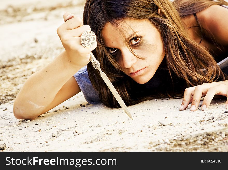 Violent dark woman armed with a knife. Violent dark woman armed with a knife