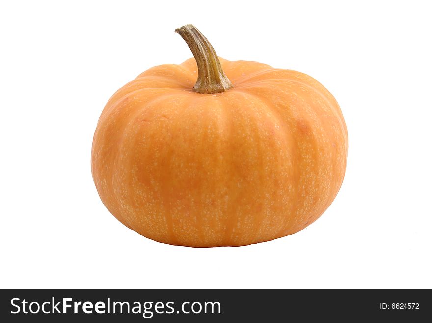 A small pumpkin isolated on a white background. A small pumpkin isolated on a white background.