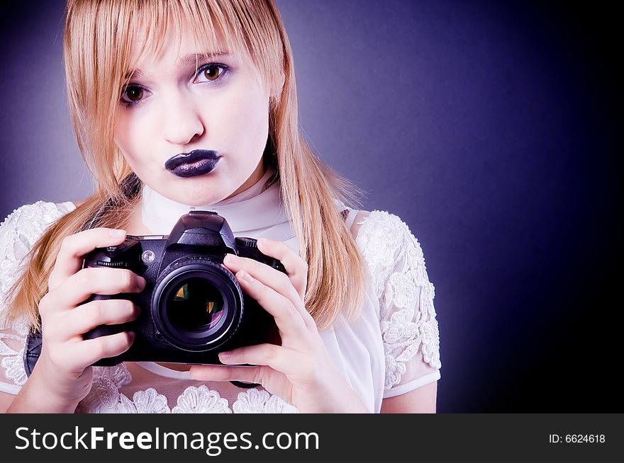 Young girl with camera