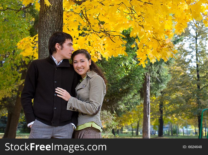 Moment of love. Young beautiful couple have fun In autumn outdoors