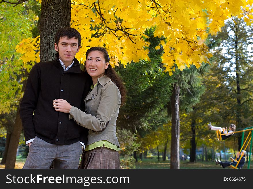 Moment of love. Young beautiful couple have fun In autumn outdoors