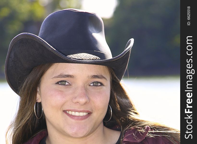 A cowgirl outside on a nice day