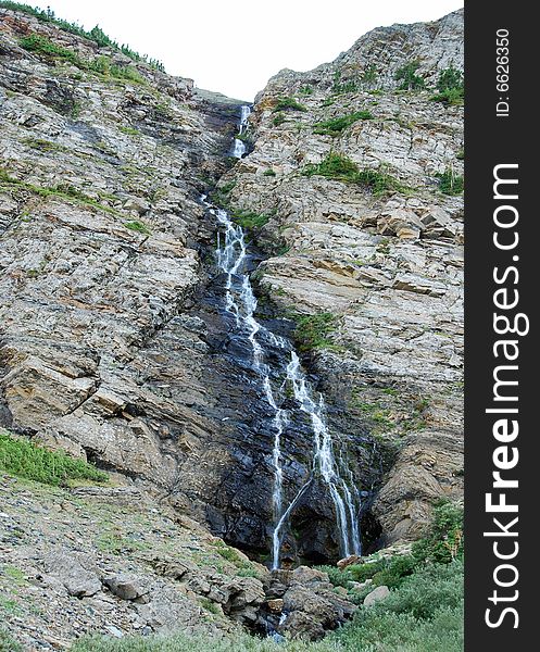 A small waterfall seen from Carthew-Alderson Trail in Waterton National Park Alberta Canada