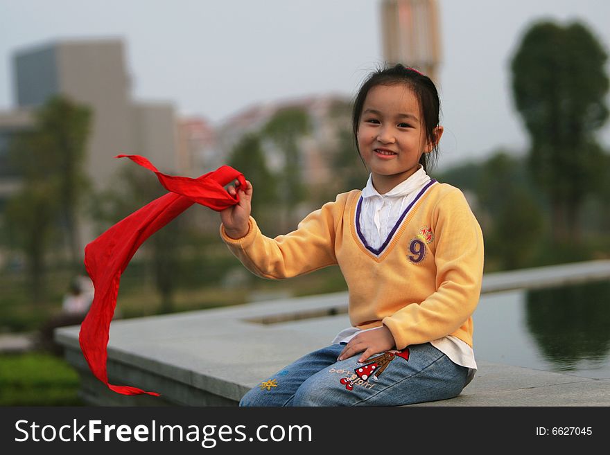 The asian  girl in a park . The asian  girl in a park .