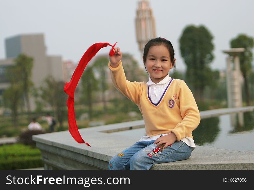 The asian girl in a park . The asian girl in a park .