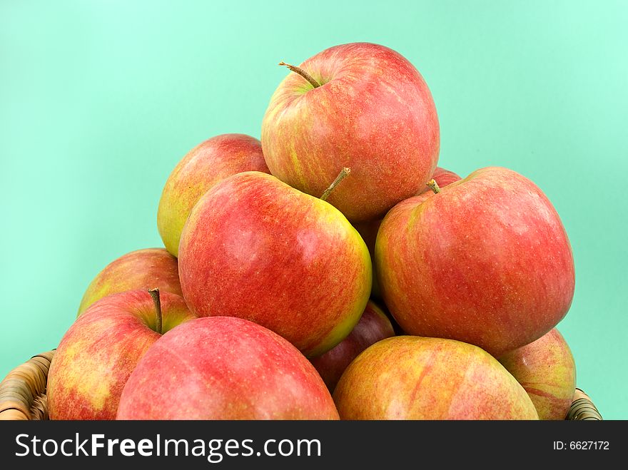 Harvesting. A basket with red ripe apples..