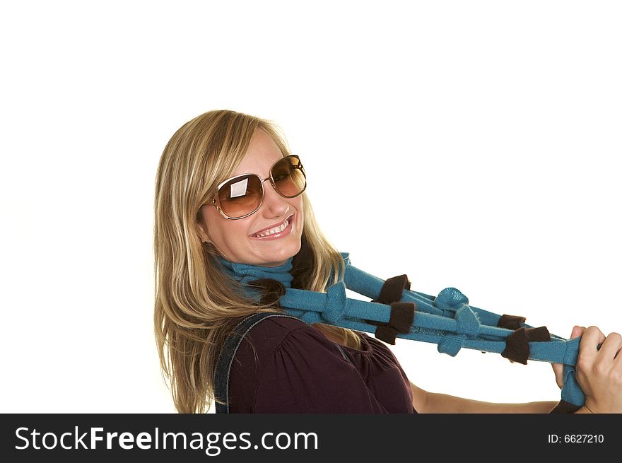 Horizontal portrait of a pretty blond wearing a scarf, and sunglasses. Horizontal portrait of a pretty blond wearing a scarf, and sunglasses