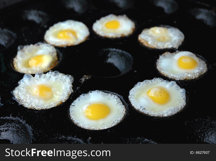 Oven fried quail eggs in a hole of Thai food. Oven fried quail eggs in a hole of Thai food.