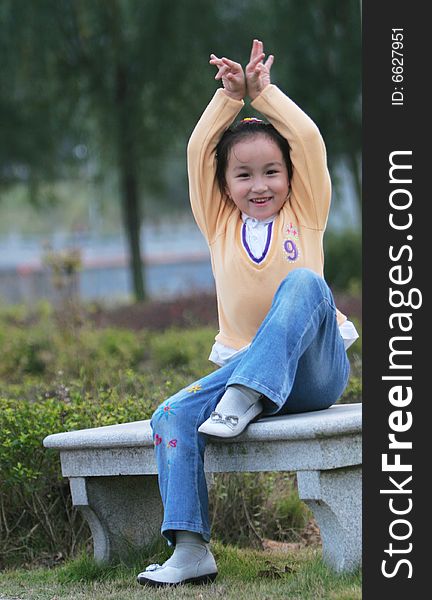 The asian  girl in a park . The asian  girl in a park .