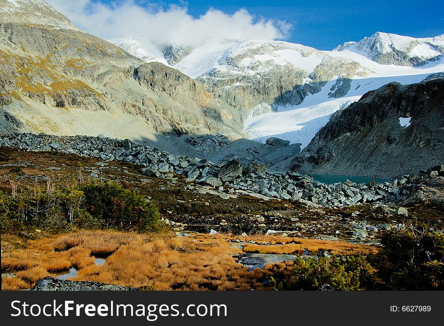 Glacier lake in the mountain in the early fall