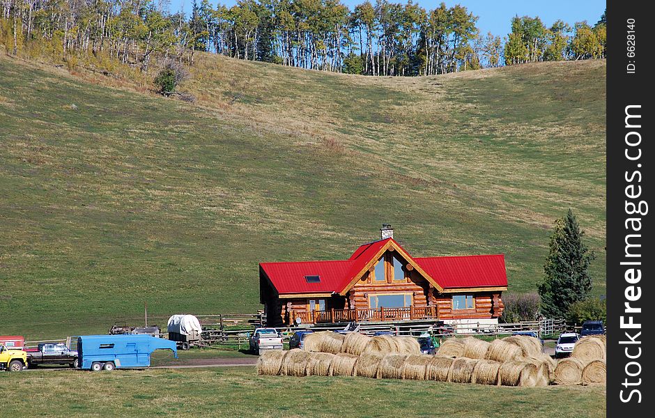 Red roof building on a Canadian farm beside highway