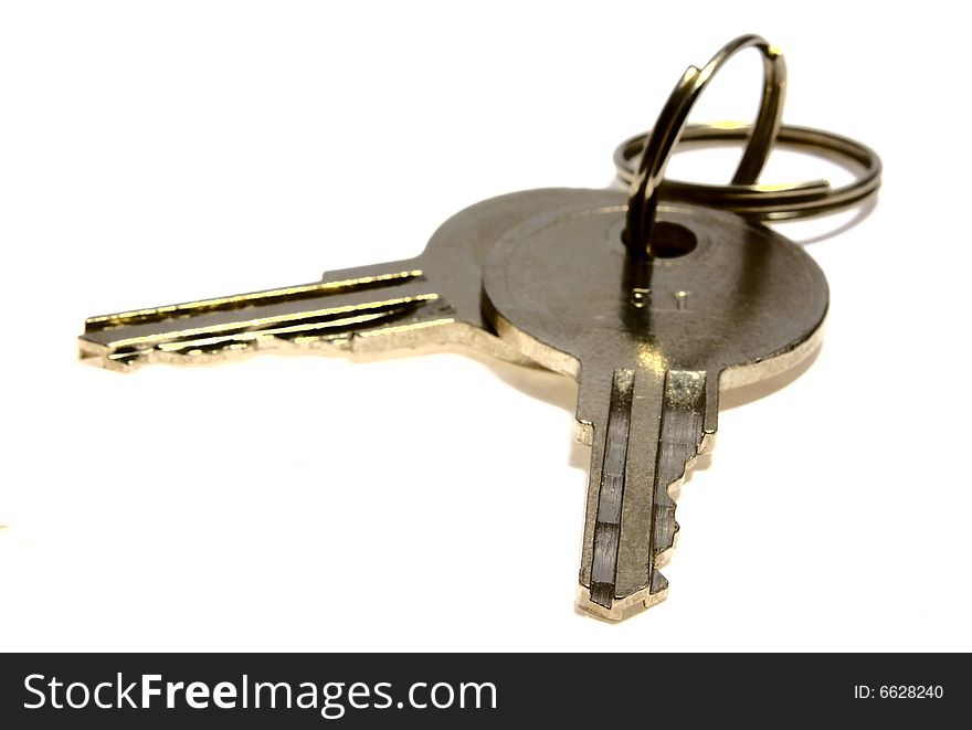 Bounch of keys from steel on a white background. Bounch of keys from steel on a white background