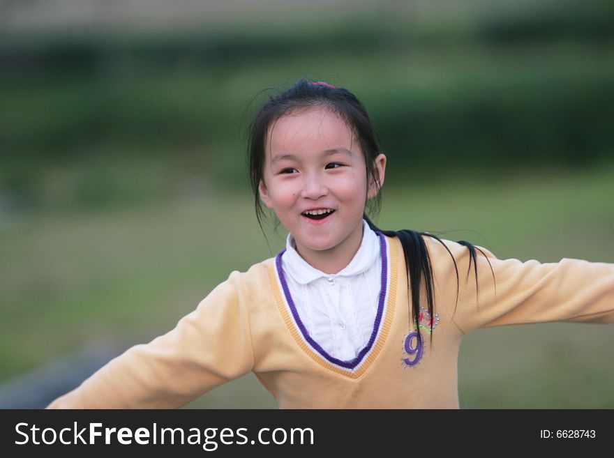 The asian girl in a park . The asian girl in a park .