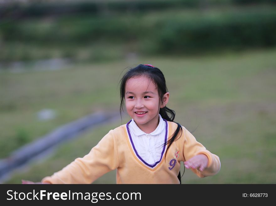 The asian  girl in a park . The asian  girl in a park .