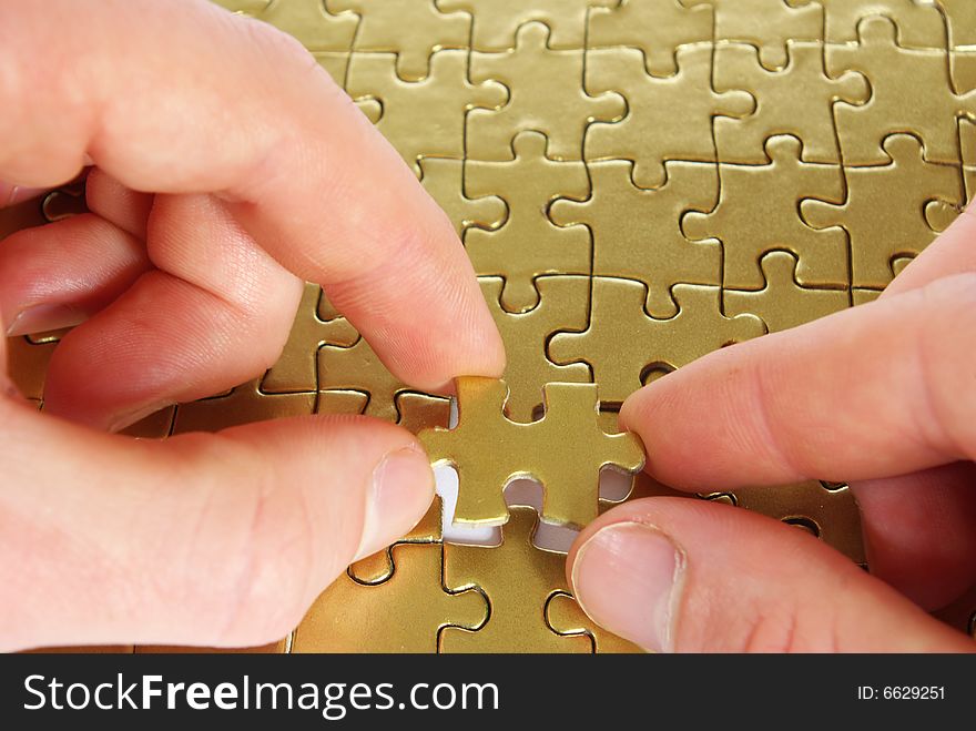 Hands holding a puzzle piece . business concepts. Hands holding a puzzle piece . business concepts