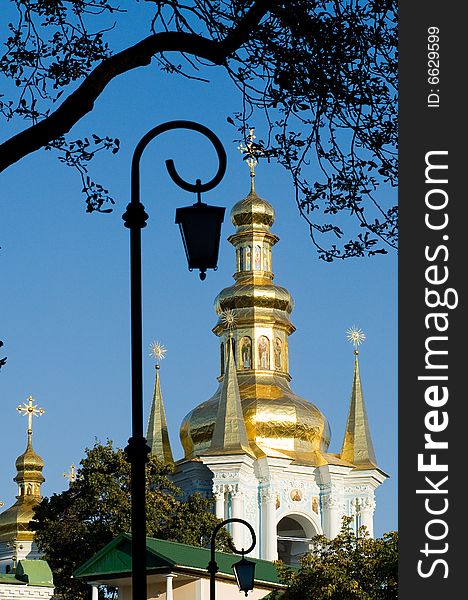 Golden church domes over blue sky background. Golden church domes over blue sky background